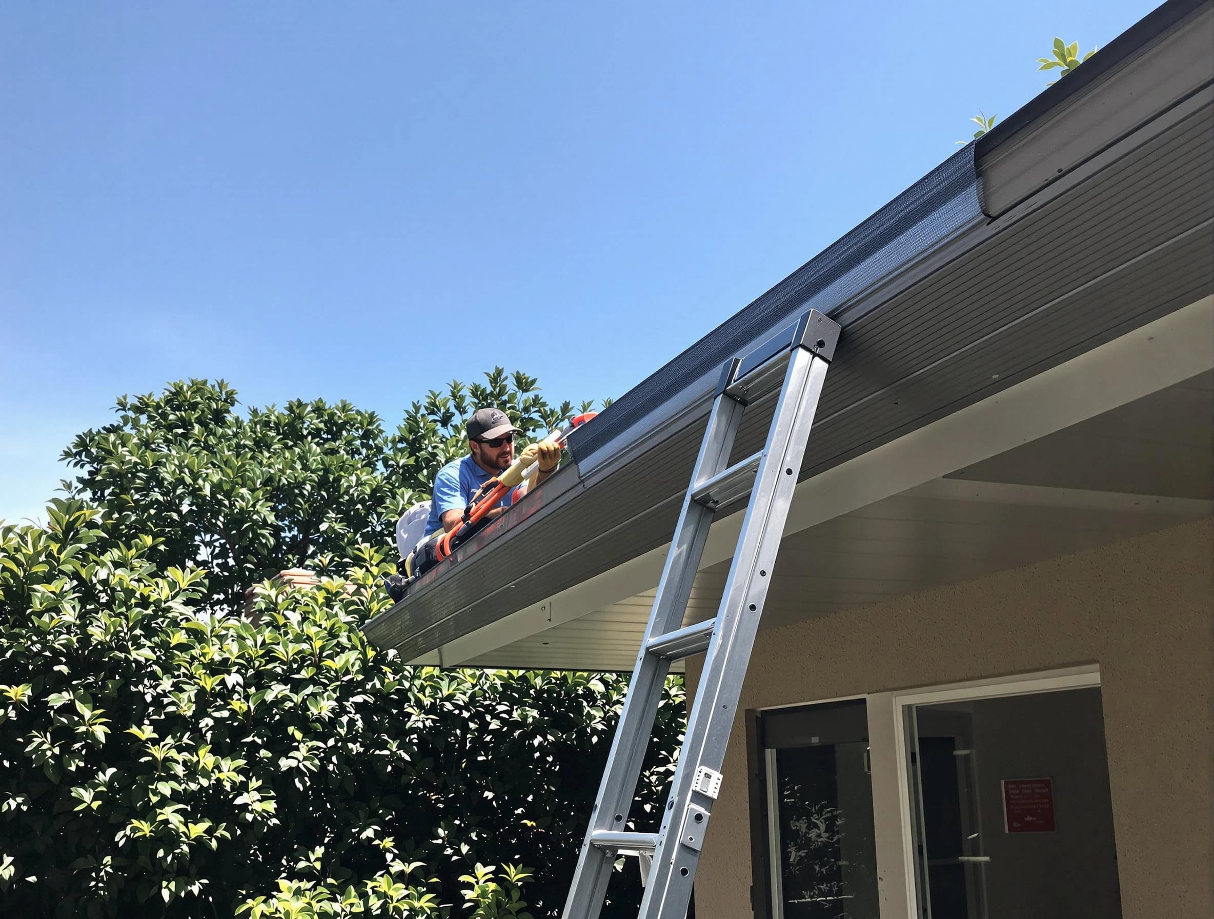 Cleveland OH Roofers installing gutter guards for a homeowner in Cleveland, OH